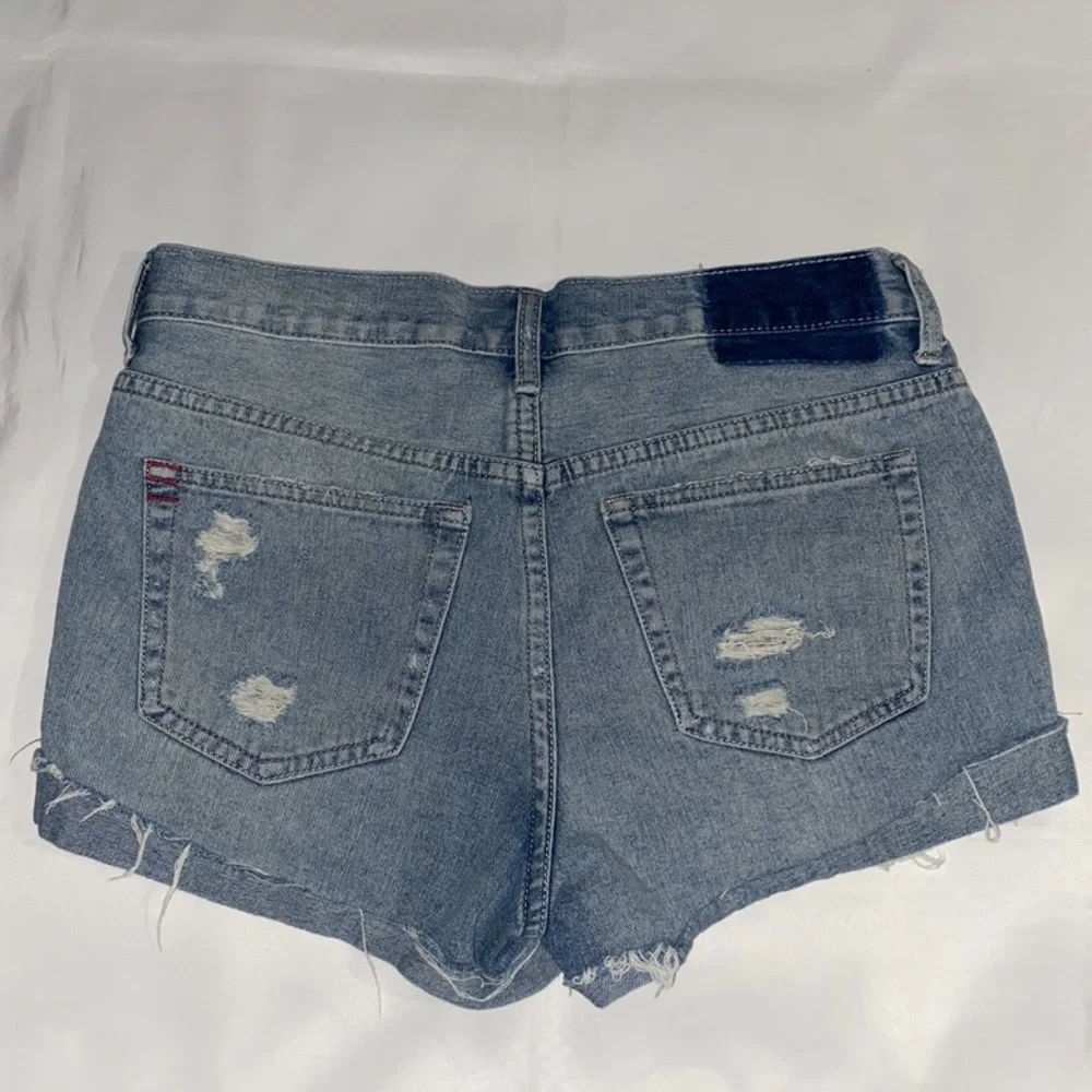 BDG High Rise Button Fly Distressed & Patched Tomgirl Jean Shorts